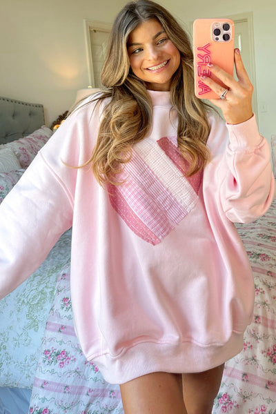 cozy women's light pink oversized mockneck sweatshirt with charming sweetheart patchwork design for casual chic style made for easy styling and with