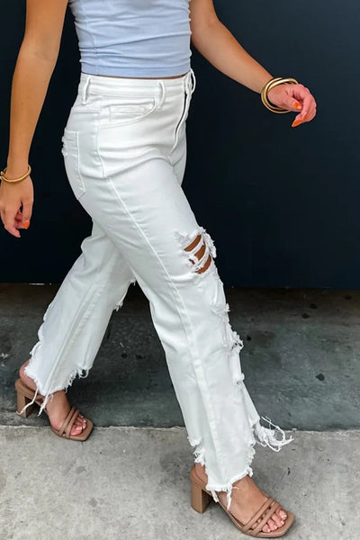 Trendy Women's White Distressed Cowgirl Jeans with Asymmetric Cut and Raw Hem  Perfect for Casual Chic Outfits