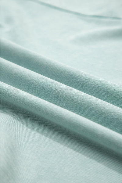 Effortless Women's Mist Blue V-Neck Pullover Top with Exposed Seams & Button Detail for Chic Casual Style