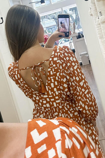 Women's Flowy Orange Geometric Short Dress with Tasseled Lace-Up V-Neck and Empire Waist for Effortless Summer Style