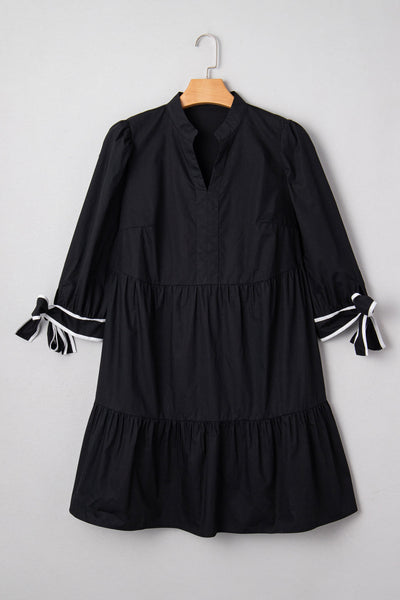 Chic Plus Size Women's Black V-Neck Mini Dress with Contrast Trim and Knot Cuffs for Effortless Style