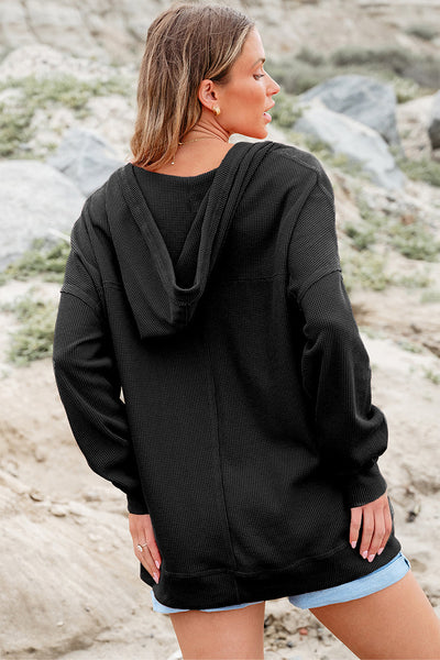 Stylish Women's Black Oversize Waffle Knit V-Neck Hoodie with Drop Shoulders and Practical Pockets for Ultimate Comfort
