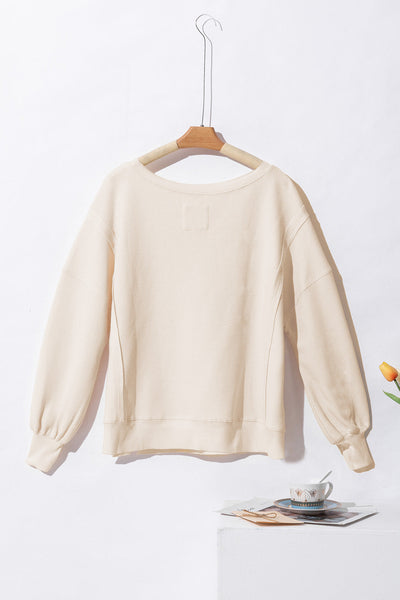 Women's Oversized White Waffle Knit Top with Bishop Sleeves and Trendy Split Detail for Effortless Chic Style