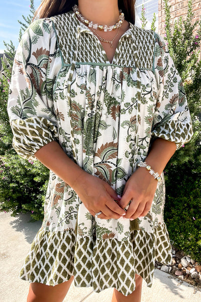 Plus Size Women's Green Floral Mini Dress with Tie Neck, Half Sleeves, and Relaxed Fit for Effortless Spring Style