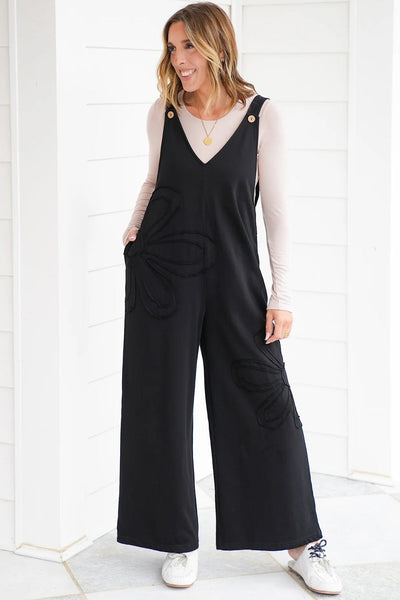 Chic Women's Black Loose-Fit Jumpsuit with Floral Patch & Raw Hem for Effortless Casual Style
