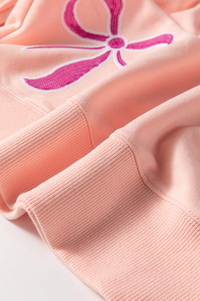 Trendy Oversized Apricot Pink Sweatshirt for Women with Sequined Bowknot - Stylish Comfort for Casual Wear