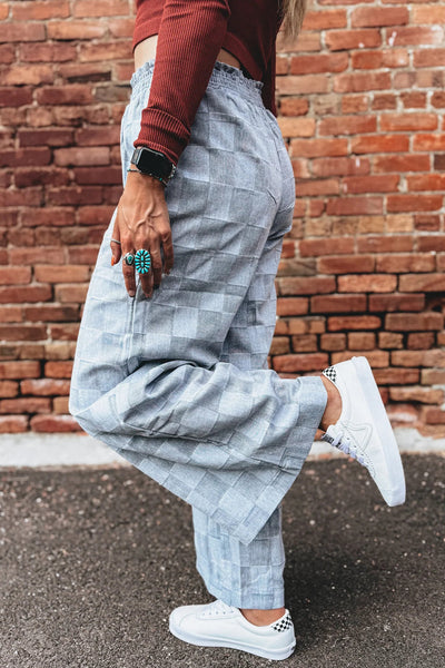 Stylish Women's Sky Blue Loose Denim Pants with Frills, Elastic Waist, and Checkered Design for Comfort and Versatility
