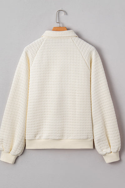 women's beige pineapple texture half-button pullover with puff sleeves made for easy styling and wardrobe coordination, with premium-like structure