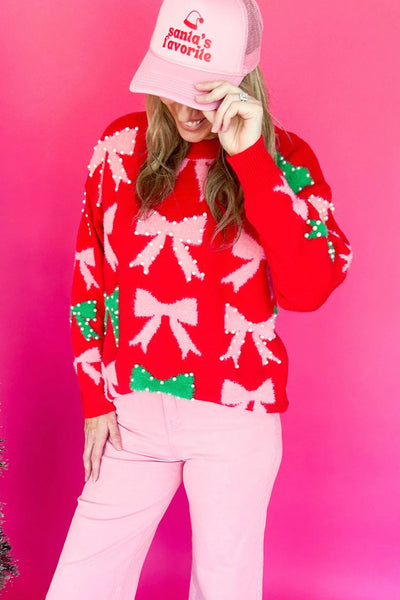 fiery red women's christmas sweater with bow and pearl detail elegant festive holiday style for a flattering fit made for easy styling and wardrobe