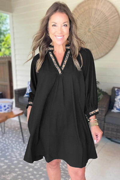 chic black mini dress with contrast trim, v-neck and bracelet sleeves perfect for women‚äôs casual or evening wear with practical styling and