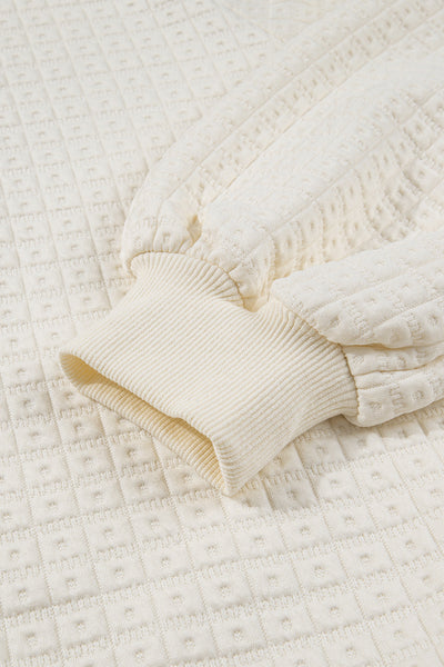 women's beige pineapple texture half-button pullover with puff sleeves made for easy styling and wardrobe coordination, with premium-like structure