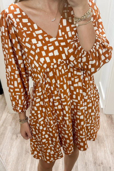Women's Flowy Orange Geometric Short Dress with Tasseled Lace-Up V-Neck and Empire Waist for Effortless Summer Style