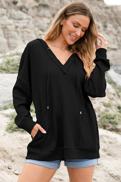 Stylish Women's Black Oversize Waffle Knit V-Neck Hoodie with Drop Shoulders and Practical Pockets for Ultimate Comfort