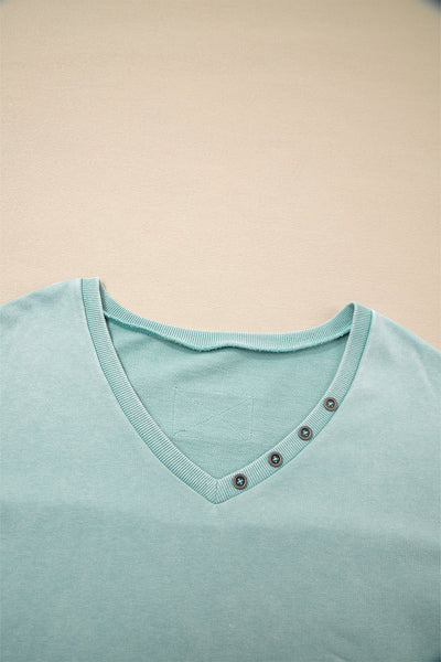 Effortless Women's Mist Blue V-Neck Pullover Top with Exposed Seams & Button Detail for Chic Casual Style