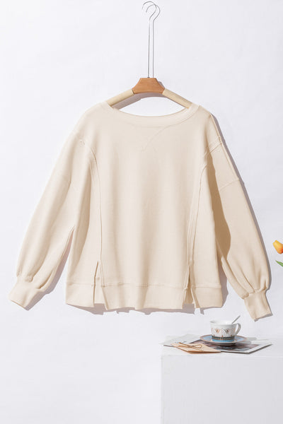 Women's Oversized White Waffle Knit Top with Bishop Sleeves and Trendy Split Detail for Effortless Chic Style