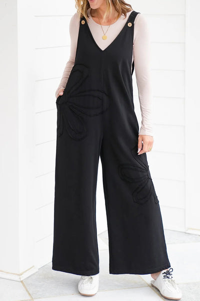 Chic Women's Black Loose-Fit Jumpsuit with Floral Patch & Raw Hem for Effortless Casual Style
