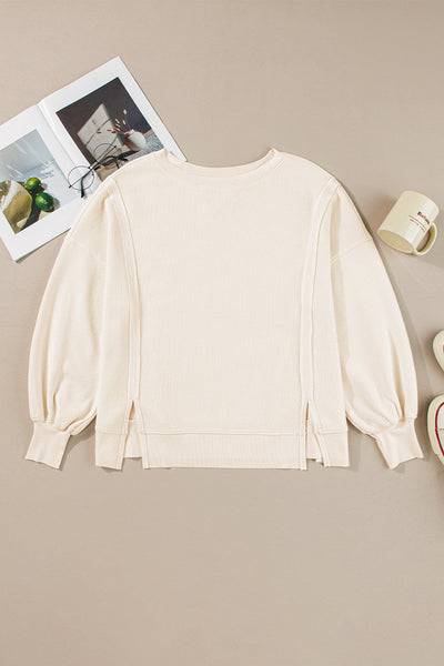 Women's Oversized White Waffle Knit Top with Bishop Sleeves and Trendy Split Detail for Effortless Chic Style