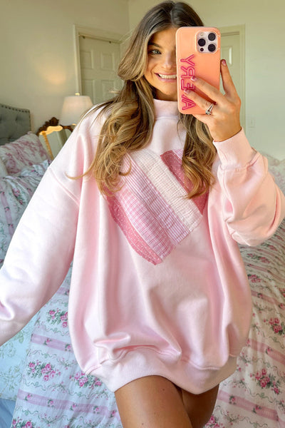 cozy women's light pink oversized mockneck sweatshirt with charming sweetheart patchwork design for casual chic style made for easy styling and with