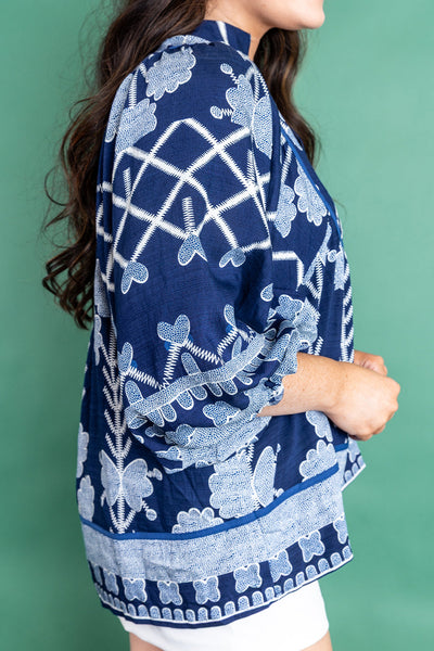 Plus Size Women's Blue Floral Blouse with Contrast Trim, Notched Neckline, and Long Sleeves for Effortless Chic Style