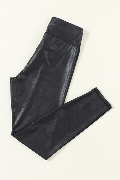 Chic Women's Black Leather Leggings with Crossed Dip Waist for a Stylish and Comfortable Fit