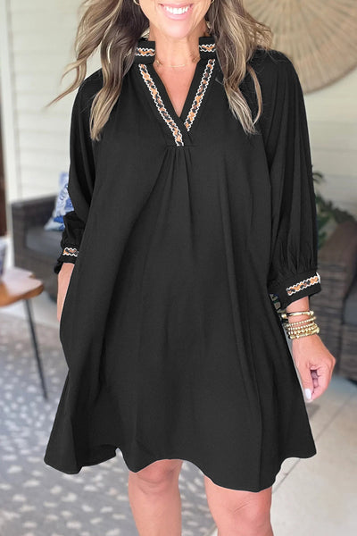 chic black mini dress with contrast trim, v-neck and bracelet sleeves perfect for women‚äôs casual or evening wear with practical styling and