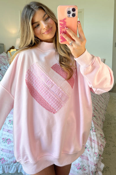 cozy women's light pink oversized mockneck sweatshirt with charming sweetheart patchwork design for casual chic style made for easy styling and with