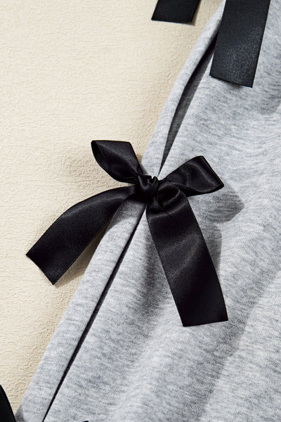 Festive Women's Merry Christmas Graphic Sweatshirt with Ribbon Bow, Split Sleeves, and Relaxed Fit for Holiday Cheer