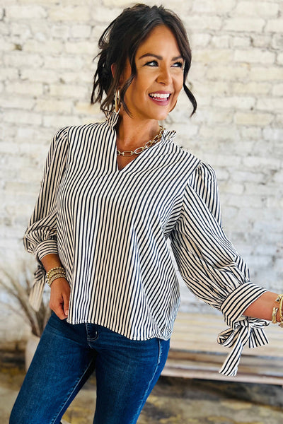 Elegant Women's Black and White Striped V-Neck Blouse with Knotted Cuffs Versatile Long Sleeve Top for Any Occasion