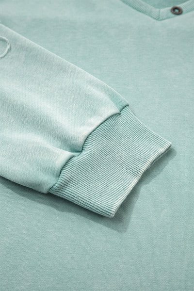 Effortless Women's Mist Blue V-Neck Pullover Top with Exposed Seams & Button Detail for Chic Casual Style