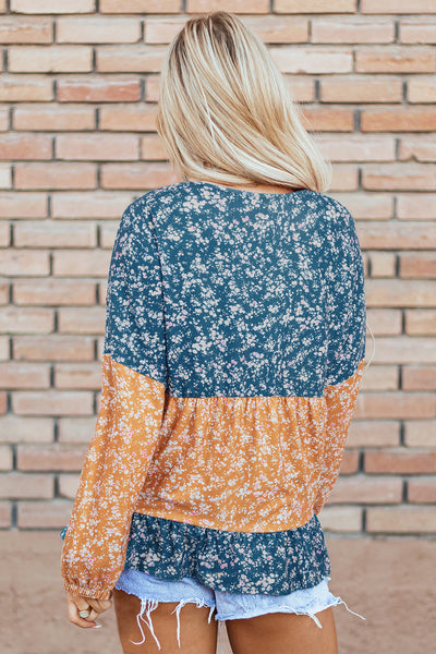 Trendy Women's Orange Floral Color Block Blouse with Ruffled Hem - Stylish Round Neck Top for Any Occasion