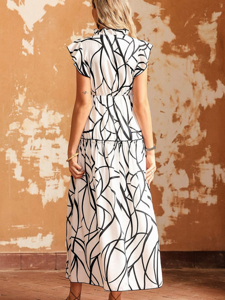 Contemporary Maxi Dress with Mesmerizing Abstract Face Print and V-Neckline