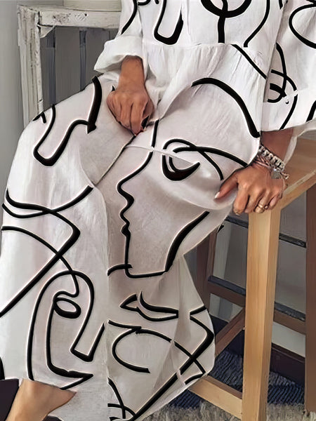 Contemporary Maxi Dress with Mesmerizing Abstract Face Print and V-Neckline