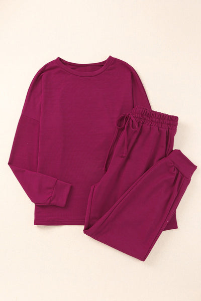 Elegant Off-shoulder Long Sleeve Jumpsuit with Drawstring Frill Hem with practical styling and dependable silhouette control.