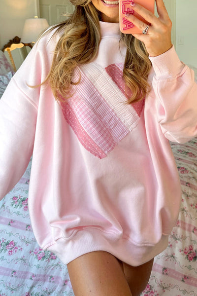 cozy women's light pink oversized mockneck sweatshirt with charming sweetheart patchwork design for casual chic style made for easy styling and with