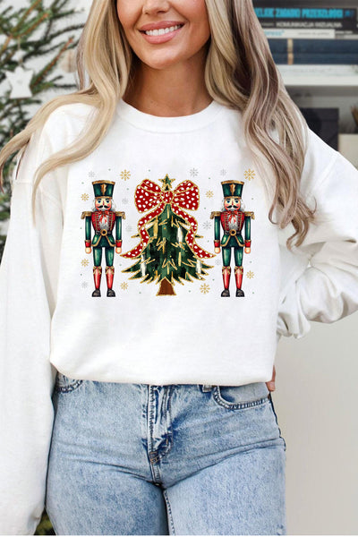 Women's Nutcracker and Christmas Tree Graphic Pullover in Winter White with practical styling and dependable silhouette control.