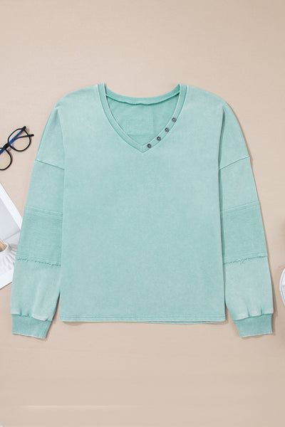 Effortless Women's Mist Blue V-Neck Pullover Top with Exposed Seams & Button Detail for Chic Casual Style