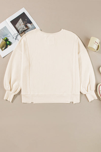 Women's Oversized White Waffle Knit Top with Bishop Sleeves and Trendy Split Detail for Effortless Chic Style