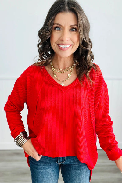 Trendy Women's Fiery Red Long Sleeve V-Neck Top with Twisted Ribbed Design and Exposed Seams for Chic Style
