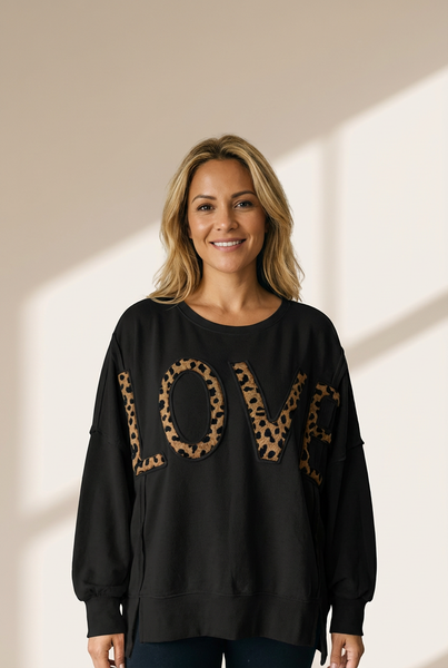 Women's Black Oversized Leopard LOVE Graphic Pullover Sweatshirt made for easy styling and wardrobe coordination, with premium-like structure and