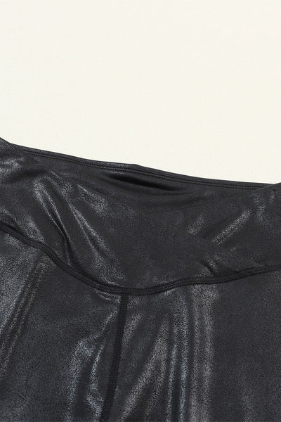 Chic Women's Black Leather Leggings with Crossed Dip Waist for a Stylish and Comfortable Fit