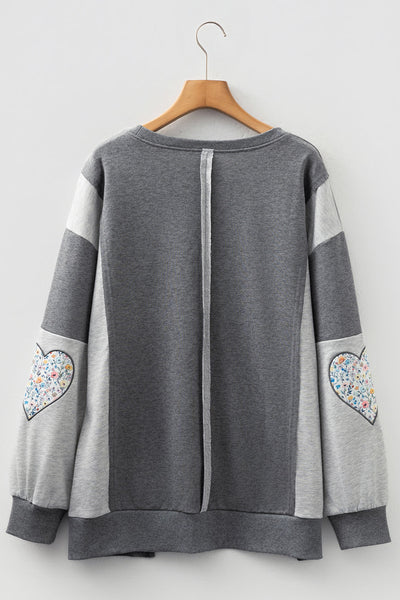 Trendy Women's Dark Grey LOVE Graphic Sweatshirt with Exposed Seams & Stylish Asymmetrical Hem for Effortless Chic Look