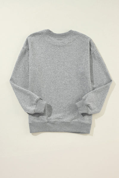 women's mixed-pattern 'merry christmas' gray drop shoulder sweatshirt made for easy styling and wardrobe coordination, with premium-like structure and