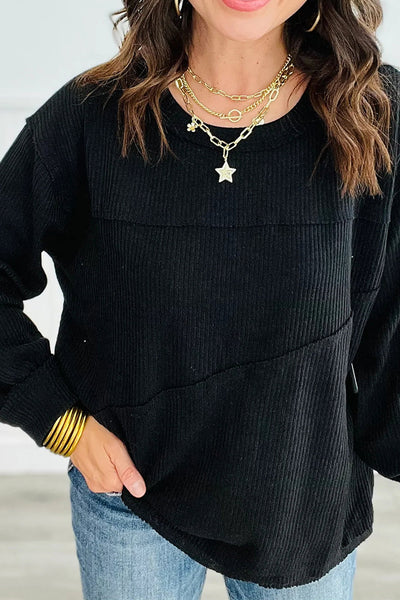 Chic Women's Black Ribbed Knit Long Sleeve Top with Exposed Seams & Trendy Patchwork Detail for Effortless Style