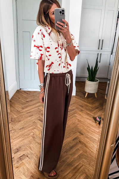 cinnamon wide leg women's pants with varsity stripes and comfortable drawstring waist for effortless style made for easy styling and wardrobe with