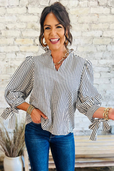 Elegant Women's Black and White Striped V-Neck Blouse with Knotted Cuffs Versatile Long Sleeve Top for Any Occasion