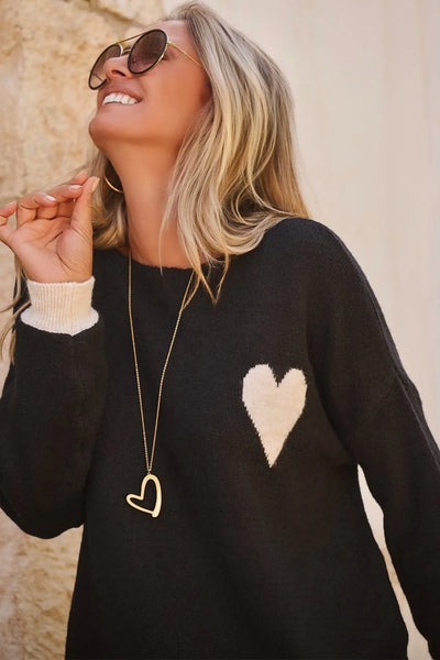 Women's Cozy Black Heart Sweater with Contrast Cuffs, Relaxed Fit for Casual Outings and Stylish Layering