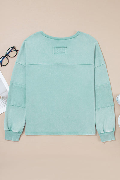 Effortless Women's Mist Blue V-Neck Pullover Top with Exposed Seams & Button Detail for Chic Casual Style