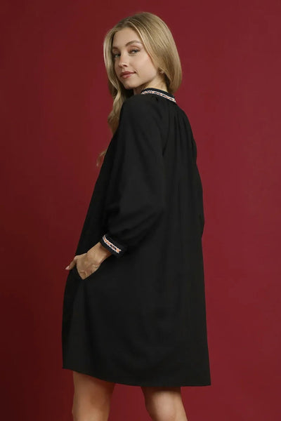 chic black mini dress with contrast trim, v-neck and bracelet sleeves perfect for women‚äôs casual or evening wear with practical styling and