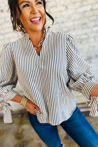 Elegant Women's Black and White Striped V-Neck Blouse with Knotted Cuffs Versatile Long Sleeve Top for Any Occasion