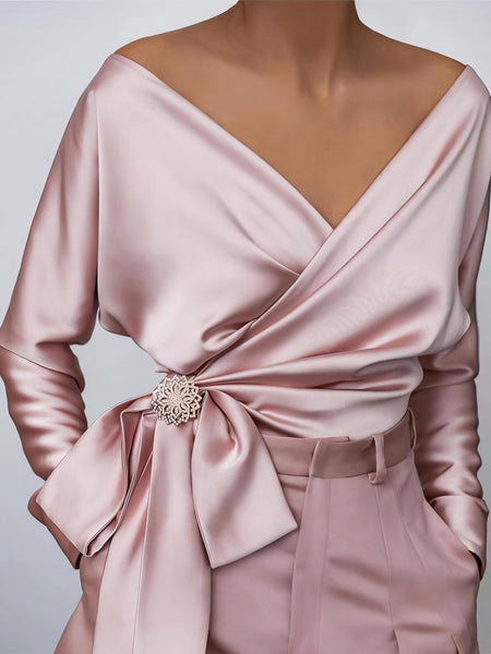 women's lustrous satin wrap blouse with brooch detail made for easy styling and wardrobe coordination, with premium-like structure and finish. with